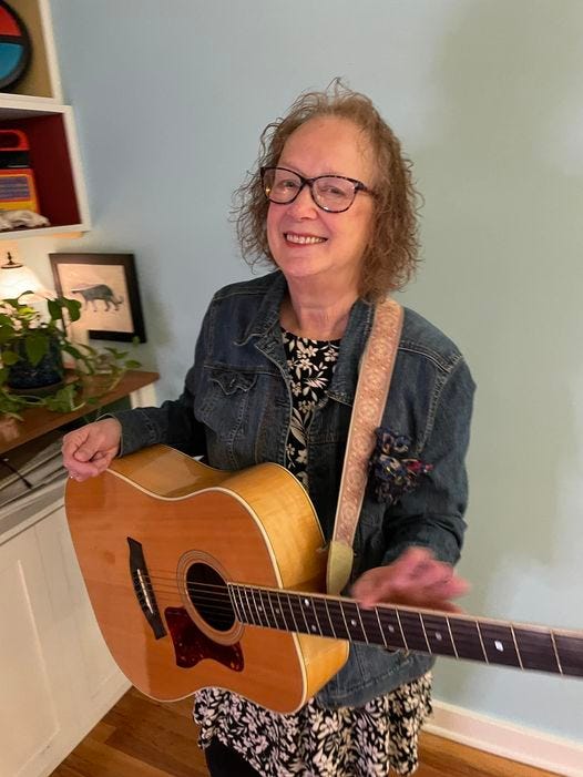 May be an image of 1 person and guitar