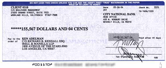 Photograph of a check to Ken ADelman for $155,567.04. 
