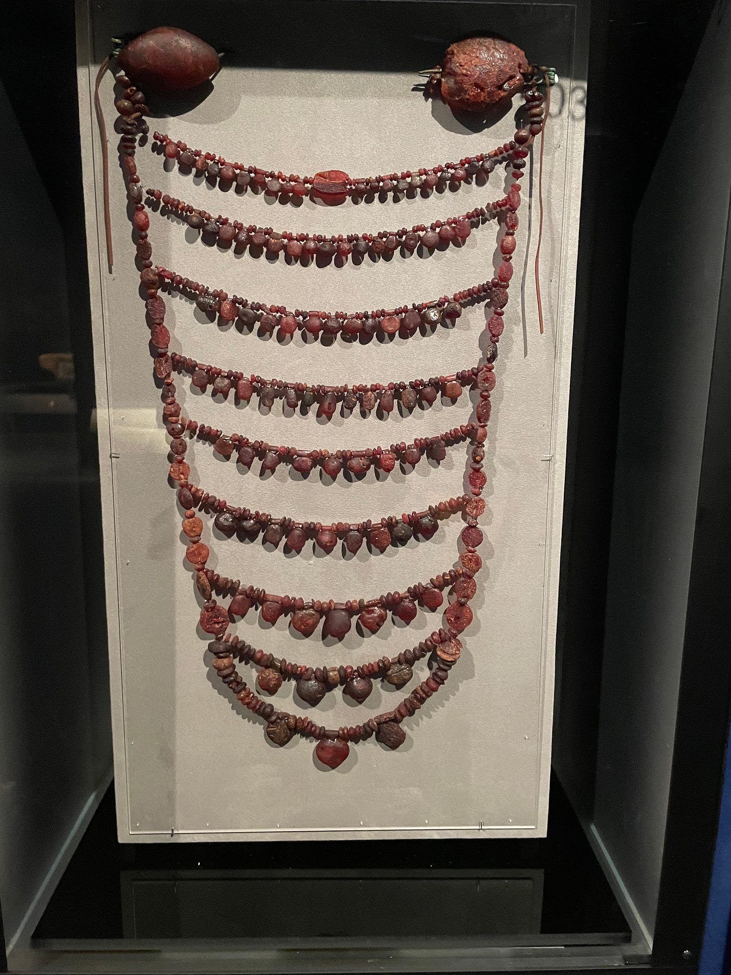 one of those ancient-style necklaces that would, like, cover a woman's neckline if she was wearing an evening gown