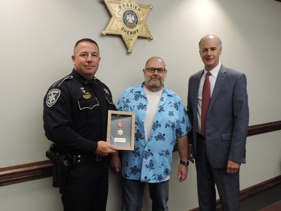 Deputy Casey Bragg received a lifesaving award from Sheriff Julian Whittington for responding...