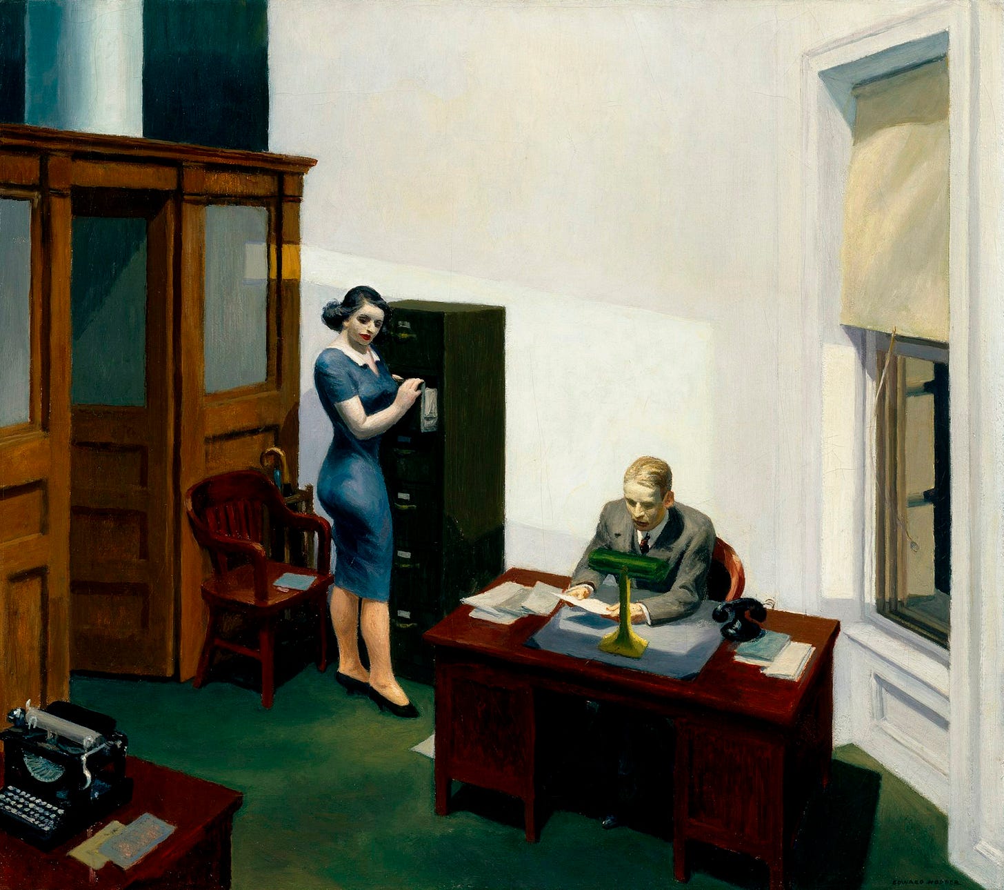 El cuadro Office at Night de Edward Hopper. Un hombre trajeado con cara cansada mira unos papeles sentado a un escritorio de madera, en un despacho estadounidense de los años 30. Una mujer le mira desde un archivador a sus espaldas. Es de noche y hay una lámpara encendida sobre el escritorio.