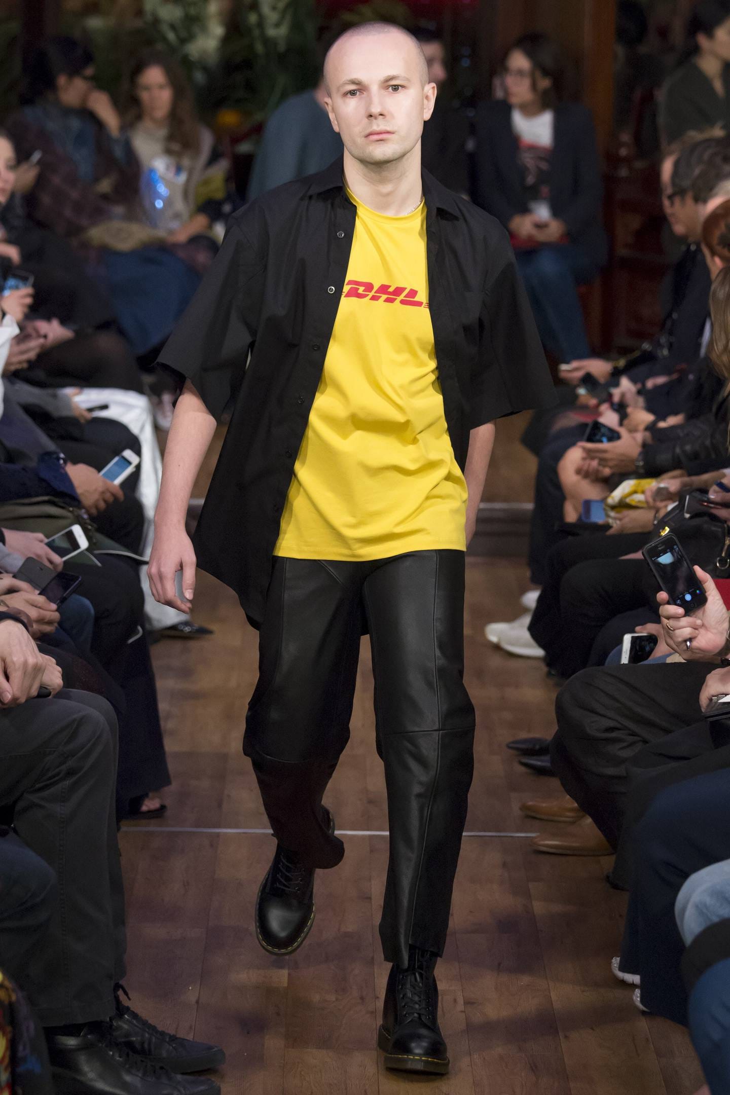 Fashion designer Gosha Rubchinskiy on the runway for Vetements, sporting the cult DHL T-shirt. Picture / Vogue Runway