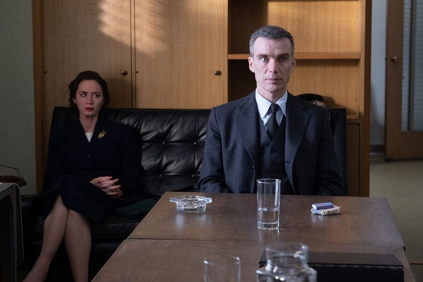 Emily Blunt is Kitty Oppenheimer and Cillian Murphy is J. Robert Oppenheimer in OPPENHEIMER, written, produced, and directed by Christopher Nolan.