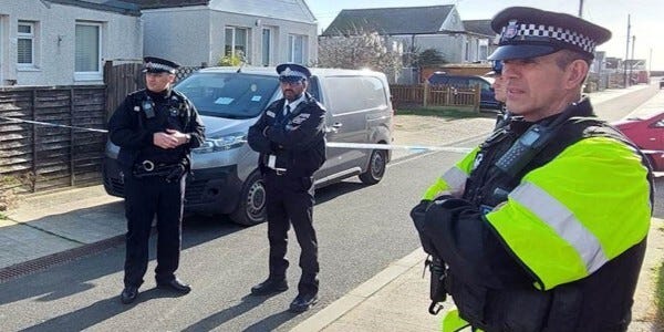 Three officers at the scene of the attack in Jaywick