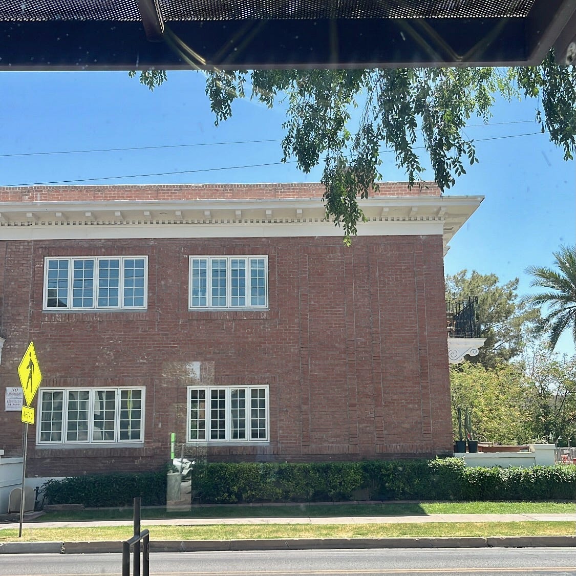 an old brick apartment building, my view out the window of Lola Coffee