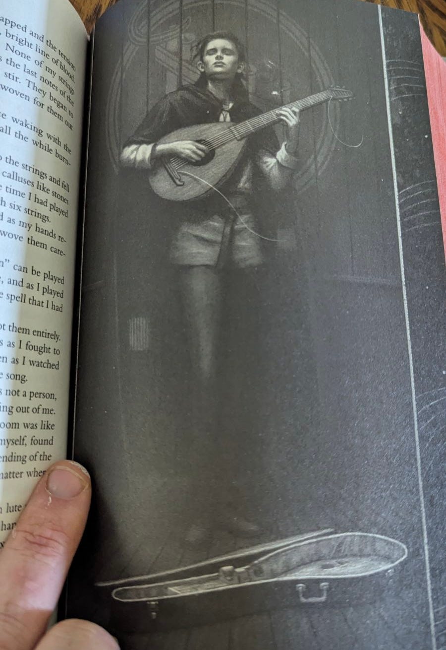 A boy closes his eyes and feels into the music as he plays lute on only six strings; the seventh flies loose and snapped A boy closes his eyes and feels into the music as he plays lute on only six strings; the seventh flies loose and snapped