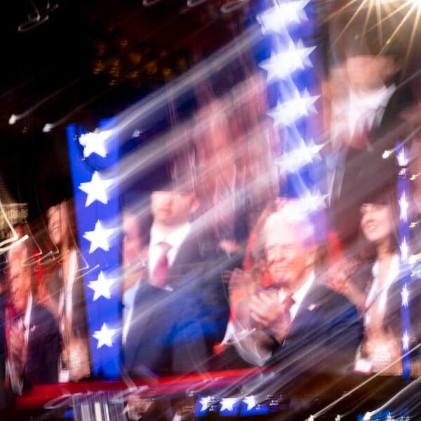 An image of Donald Trump standing and clapping is projected on the Jumbotron at the Republican National Convention.