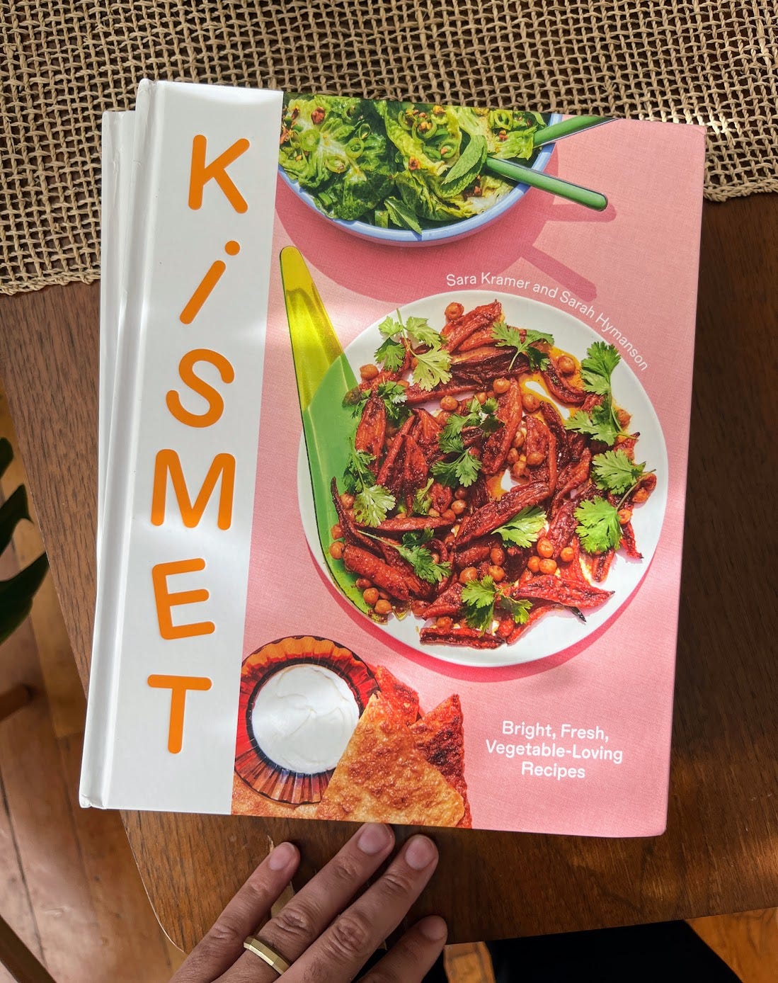 stack of Kismet cookbooks on a table