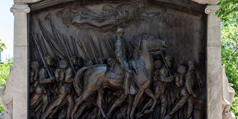 The bronze relief statue showing the soldiers of the 54th Massachusetts infantry marching, with Col. Robert Gould Shaw on horseback. 