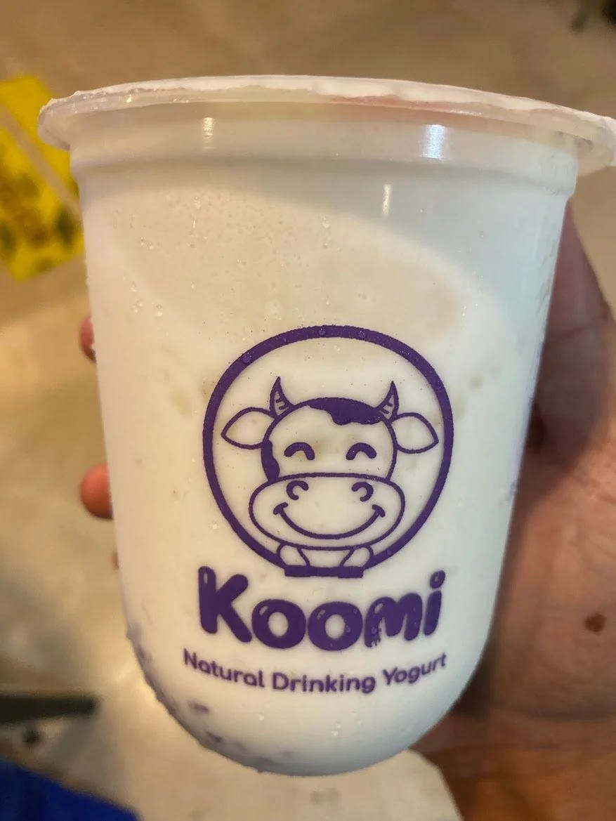 A cup of Koomi Coconut Purple Rice