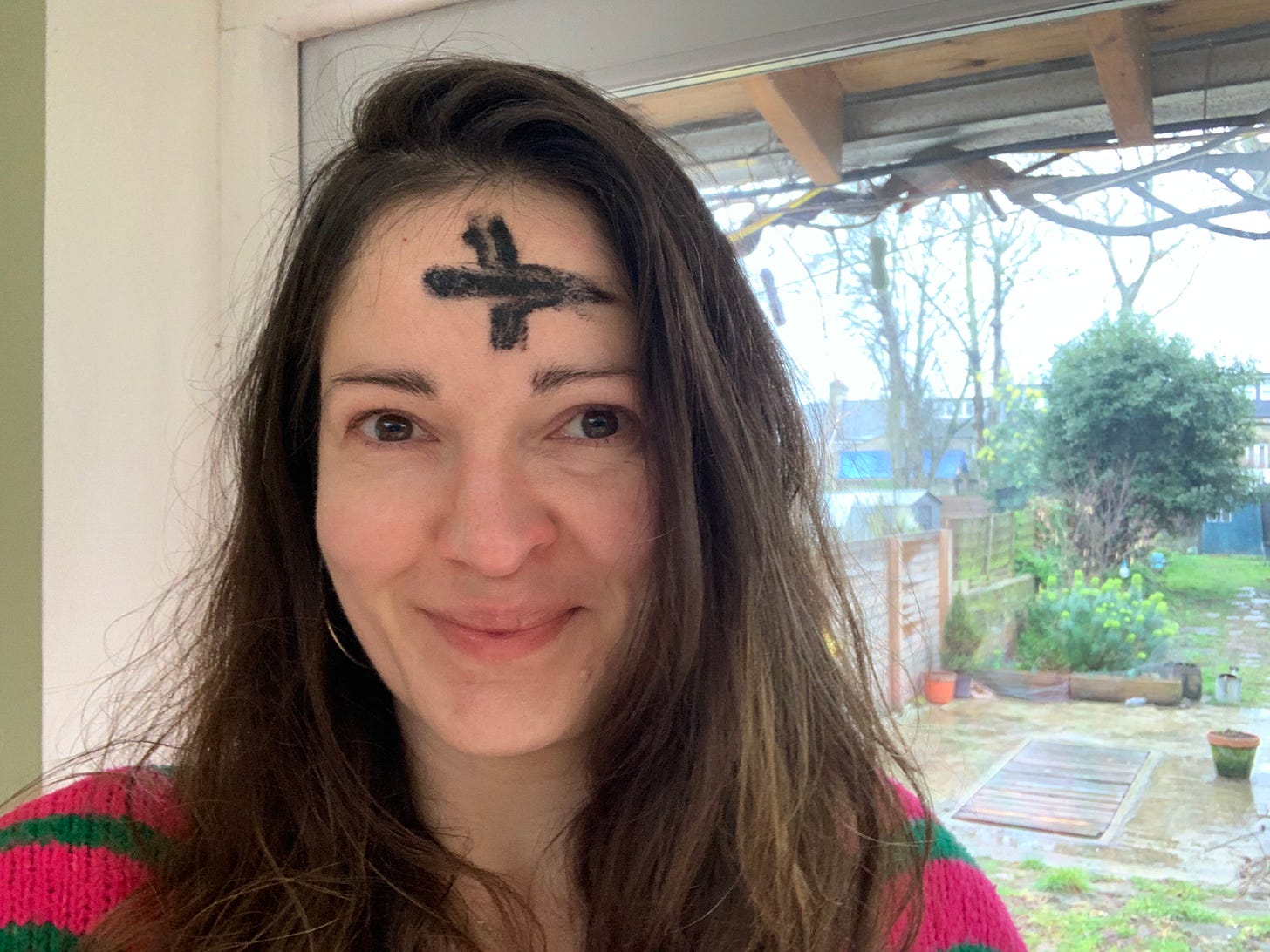 Picture of Elizabeth Oldfield with ash cross on forehead