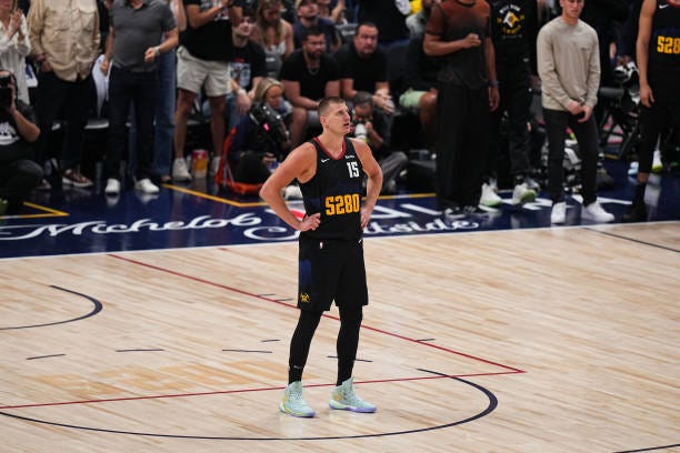 Nikola Jokic of the Denver Nuggets looks on during the game against the Minnesota Timberwolves during Round 2 Game 7 of the 2024 NBA Playoffs on May...