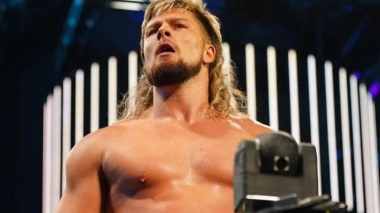 Brian Pillman Jr. poses on the stage before heading down to the ring in AEW.
