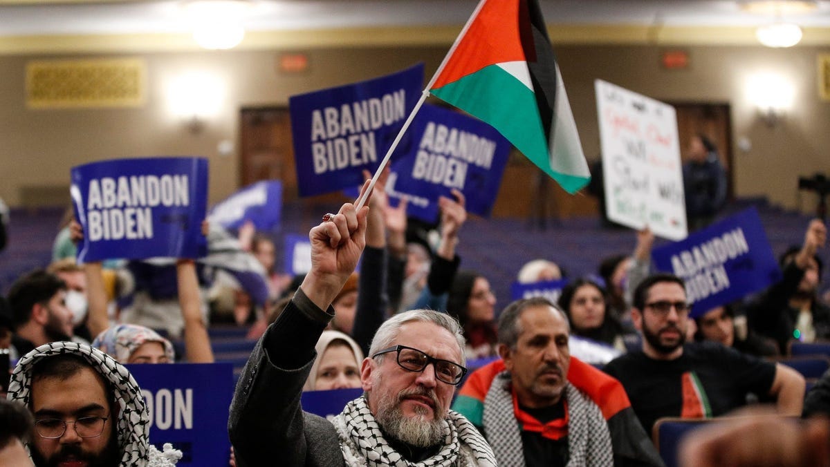 Attendees chant "Ceasefire Now" during a community rally to boycott President Biden's visit at Fordson High School in Dearborn on Jan. 31, 2024.