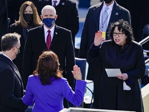 WASHINGTON, DC - JANUARY 20: Kamala Harris is sworn as U.S. Vice President by U.S. Supreme Court Associate Justice Sonia Sotomayor as her husband Doug Emhoff looks on at the inauguration of U.S. President-elect Joe Biden on the West Front of the U.S. Capitol on January 20, 2021 in Washington, DC. During today's inauguration ceremony Joe Biden becomes the 46th president of the United States.   Drew Angerer/Getty Images/AFP == FOR NEWSPAPERS, INTERNET, TELCOS & TELEVISION USE ONLY ==