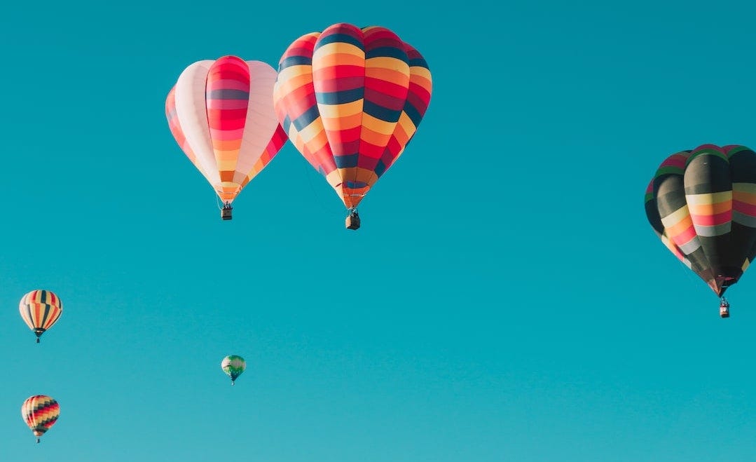 colorful hot air balloons in a clear blue sky