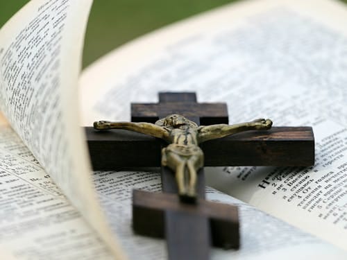 Free Crucifix on Top of Bible Stock Photo