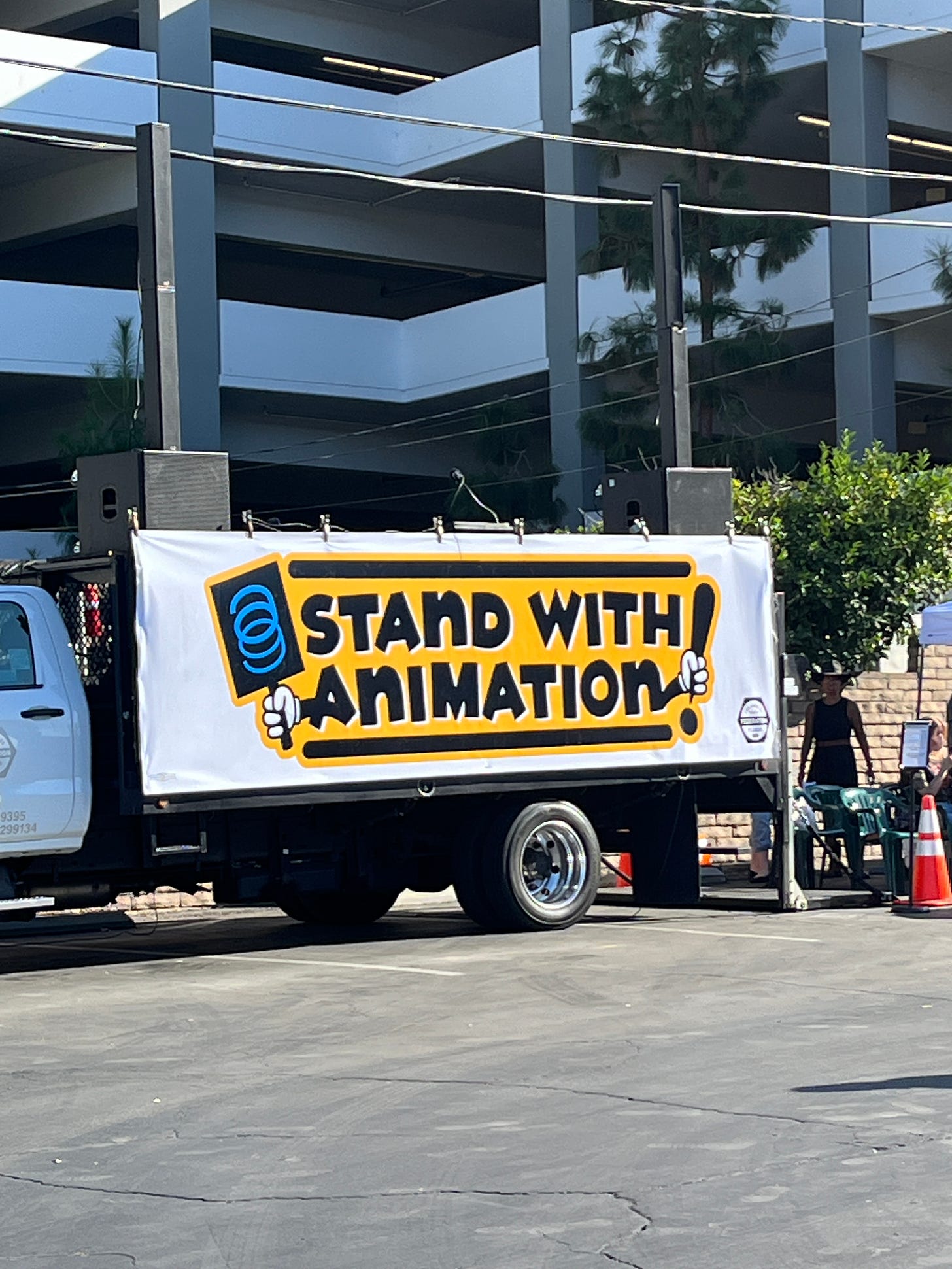 "I stand with animation" banner on a truck.