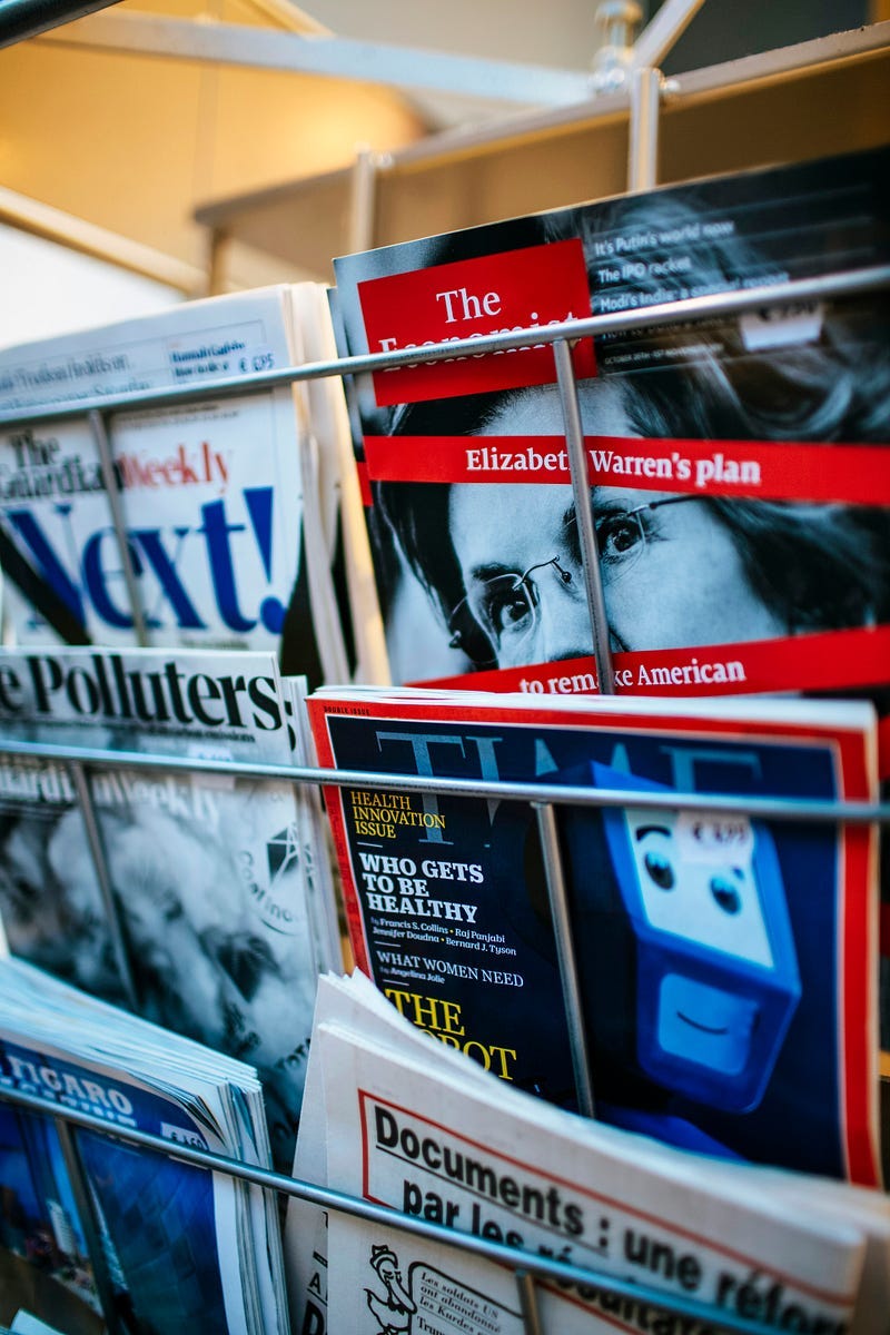 Magazines on a magazine rack.