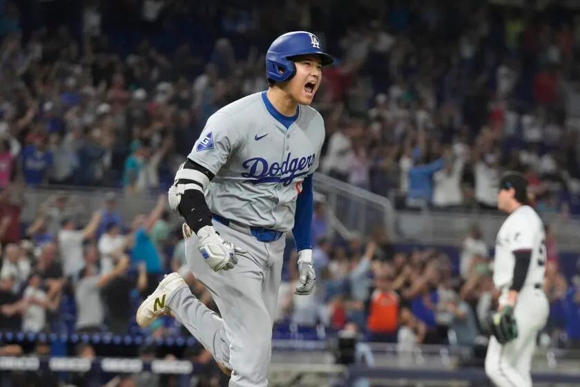 Los Angeles Dodgers' Shohei Ohtani (17) reacts after hitting his 50th home run of the season.