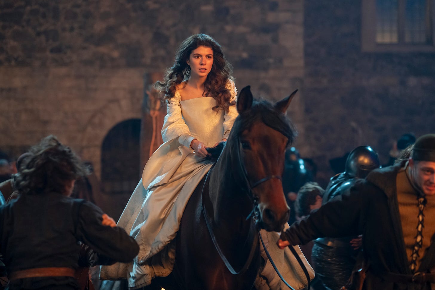 Emily Bader as Lady Jane Grey in MY LADY JANE season 1. She is riding a horse, who is also her husband.