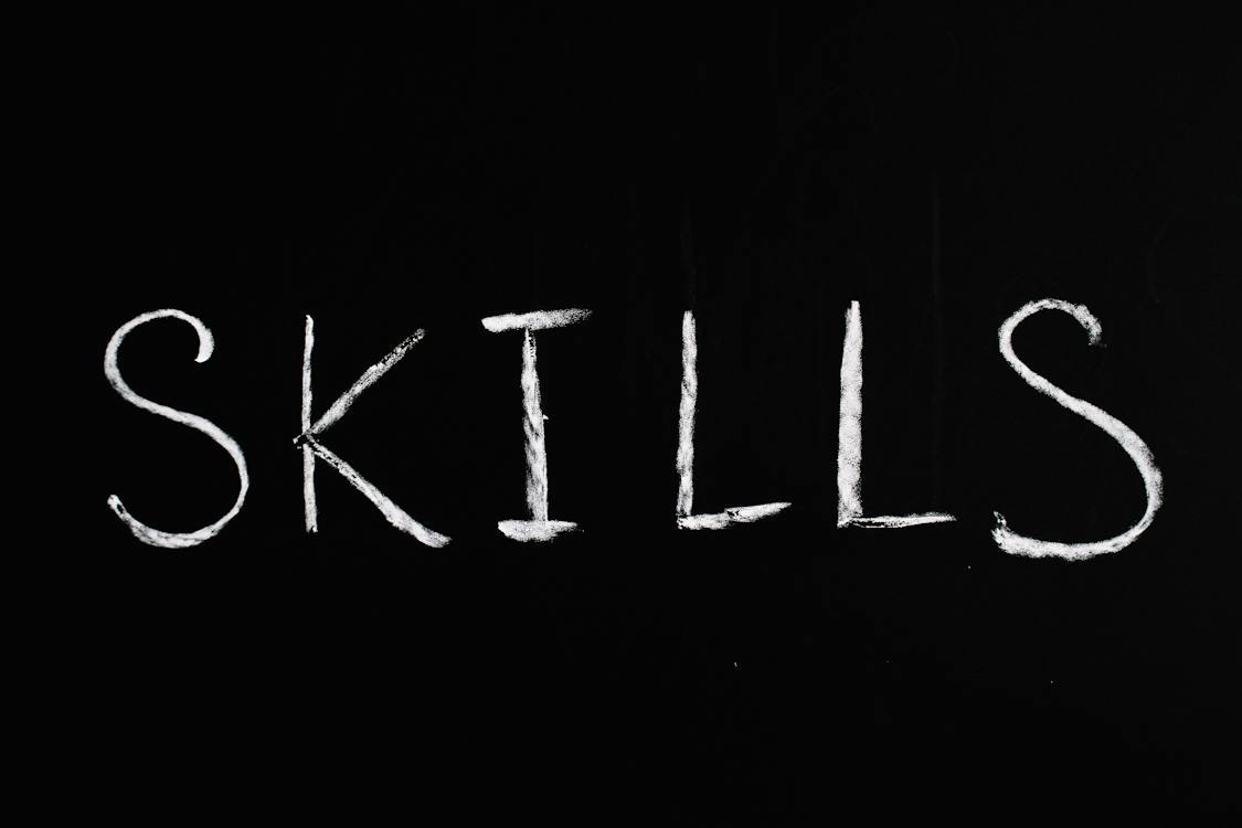 Free Skills Text on Black Background Stock Photo