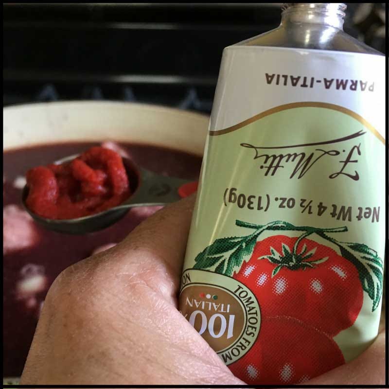 Add the tomato paste. Add the tomato paste.