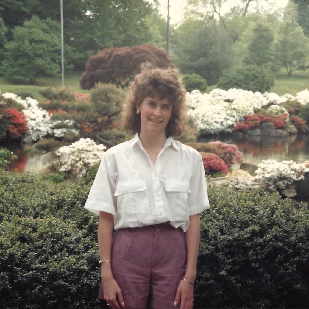 Young woman with big 80s hair is ready to embark on her journey through young adulthood