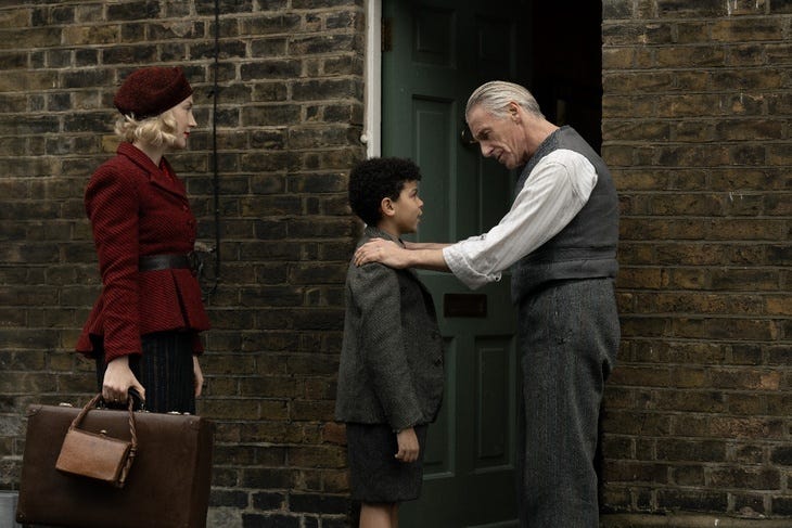 Three people dressed in 1940s attire