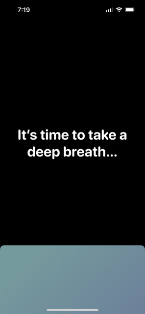 A screenshot of a phone screen showing one sec's functionality. The bottom of the screen is blue. The top two-thirds of the screen is black with white text that says "It's time to take a deep breath..."