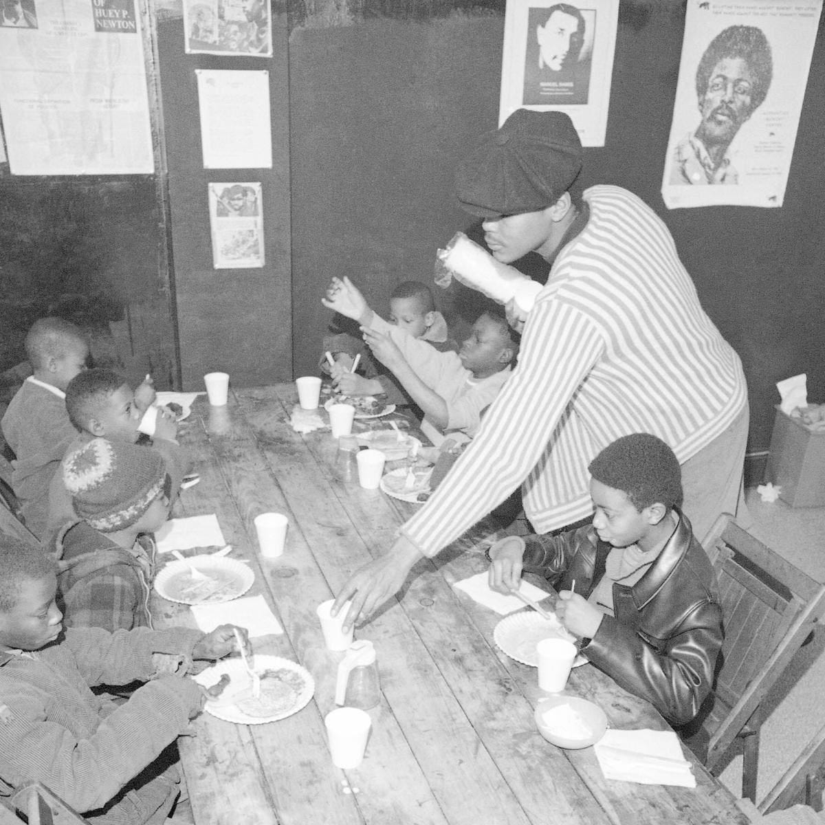 Brad Jones, member of the Philadelphia Black Panthers Organization, helping serve breakfast to youngsters. (Credit: Bill Ingraham/AP Photo)