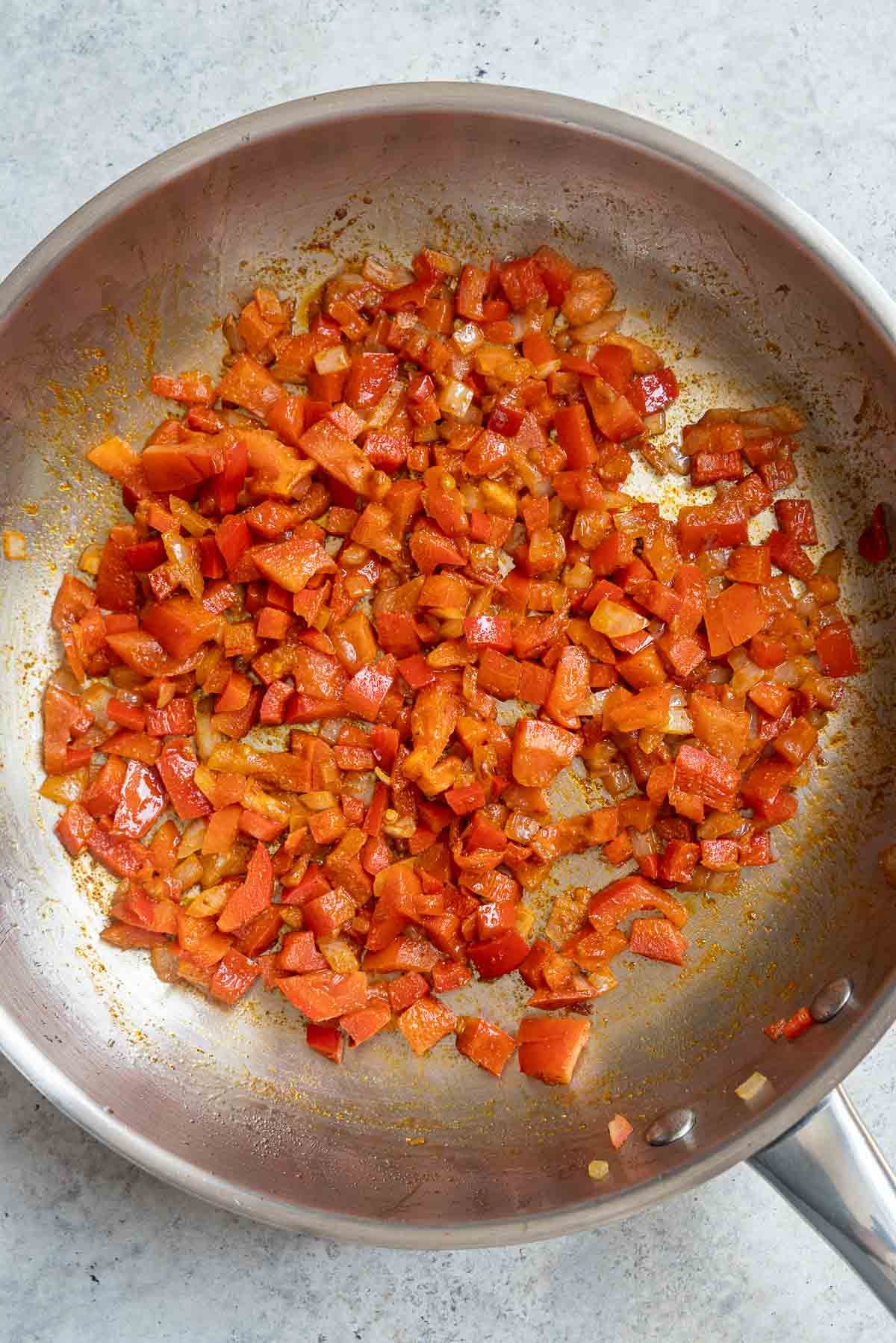 Stir Frying tomato and spices with the rest of the ingredients