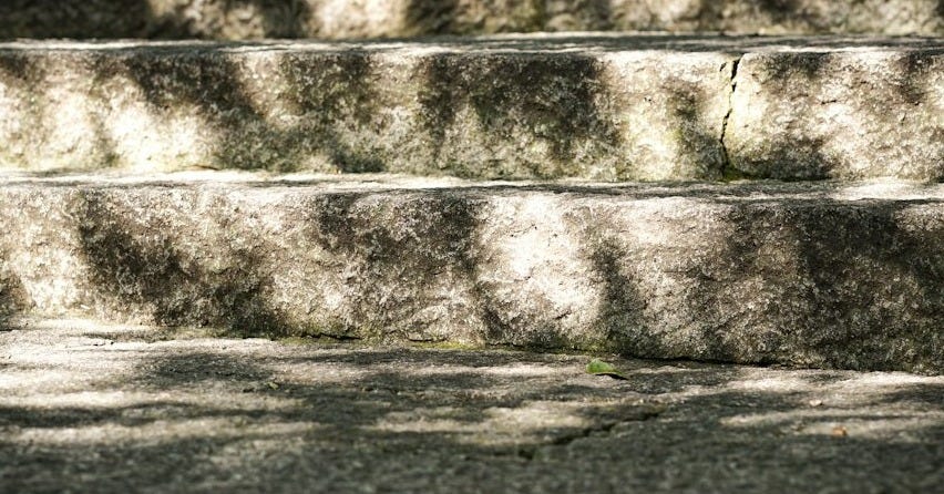 a person riding a skateboard down some steps