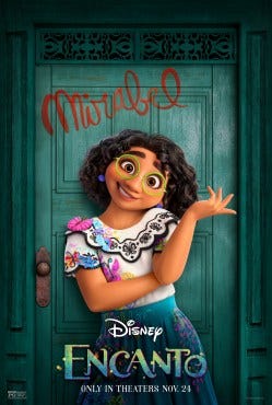 Maribel from Encanto standing in front of her green door with her name written on it