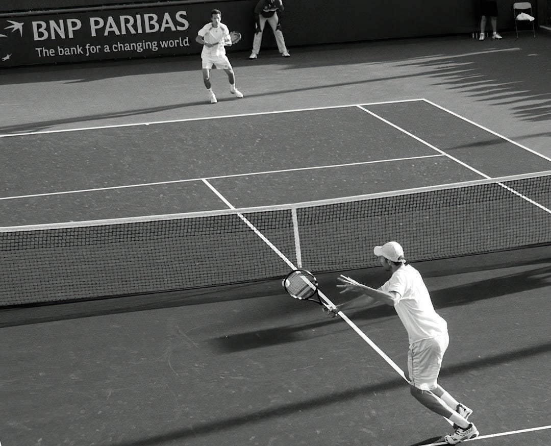 two men playing lawn tennis in grayscale photography