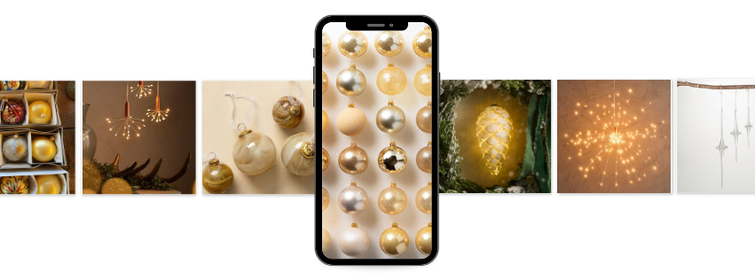 A luxurious, festive display of metallic gold and silver ornaments arranged in a row, centered around a phone screen displaying the same holiday ornaments. In the background, decorative starbursts and glowing pinecone-shaped lights add sparkle and warmth, creating a festive, luxurious atmosphere perfect for the holiday season.