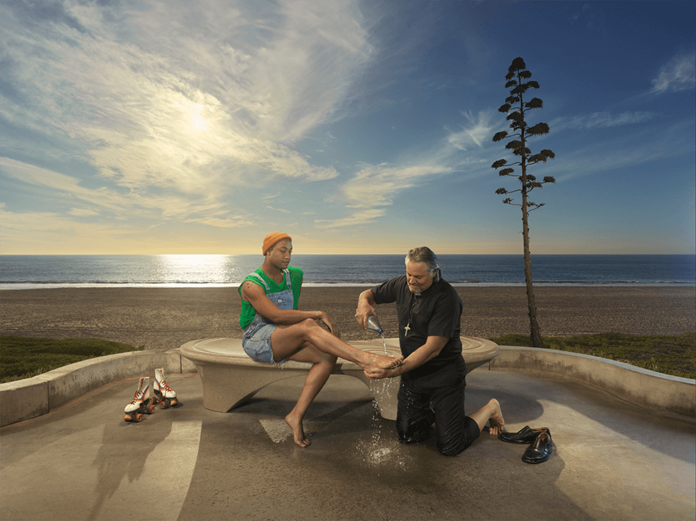 Priest washing feet of gay man