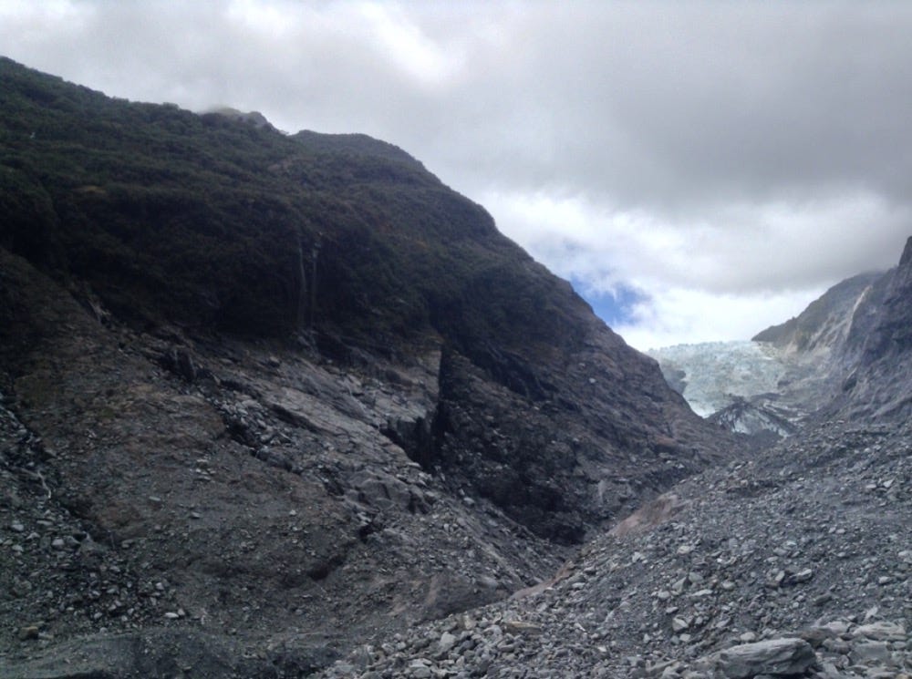 Rocky landscape, glacier retreated to the far end and looks small