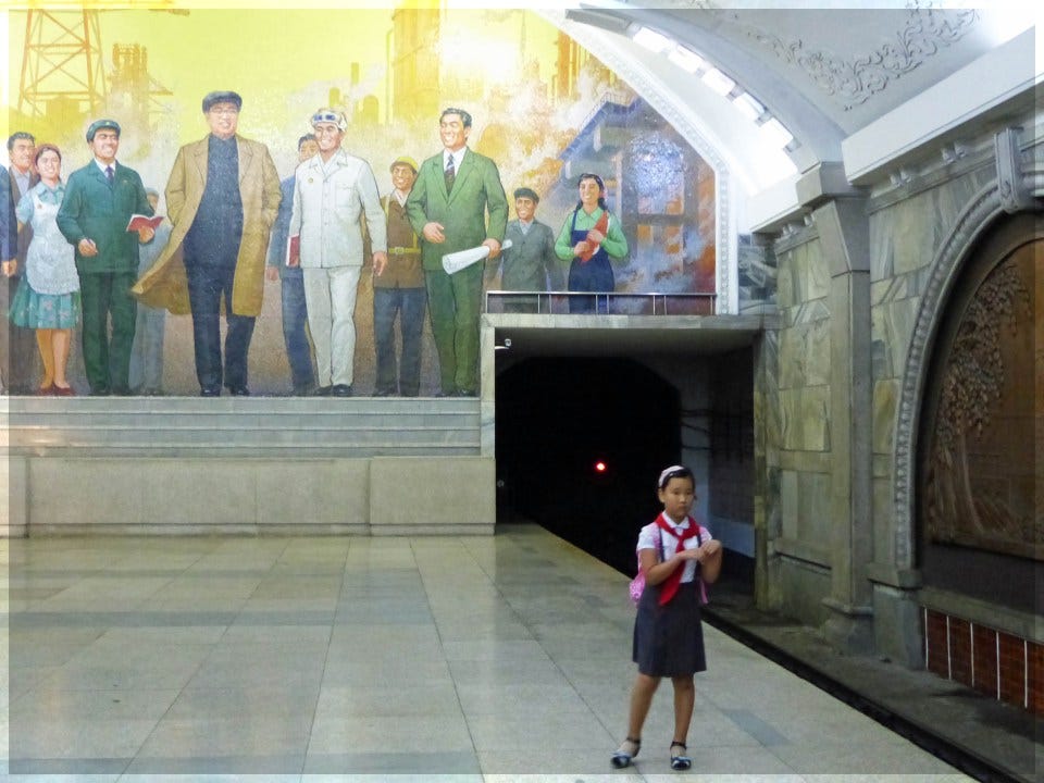 Girl in uniform on a station platform