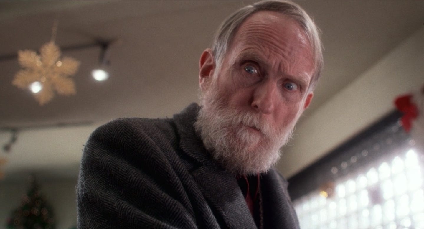 Old Man Marley from Home Alone. He is an old man with a white beard.