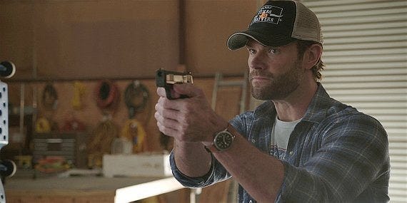 Walker Cordell pointing gun at bady guy in baseball cap 217.