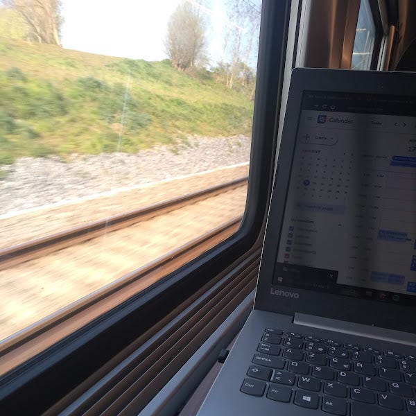 Photo of a laptop on a train table