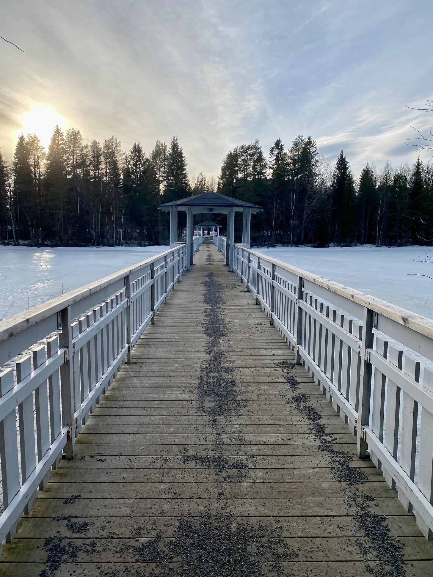Long bridge spanning a frozen lake