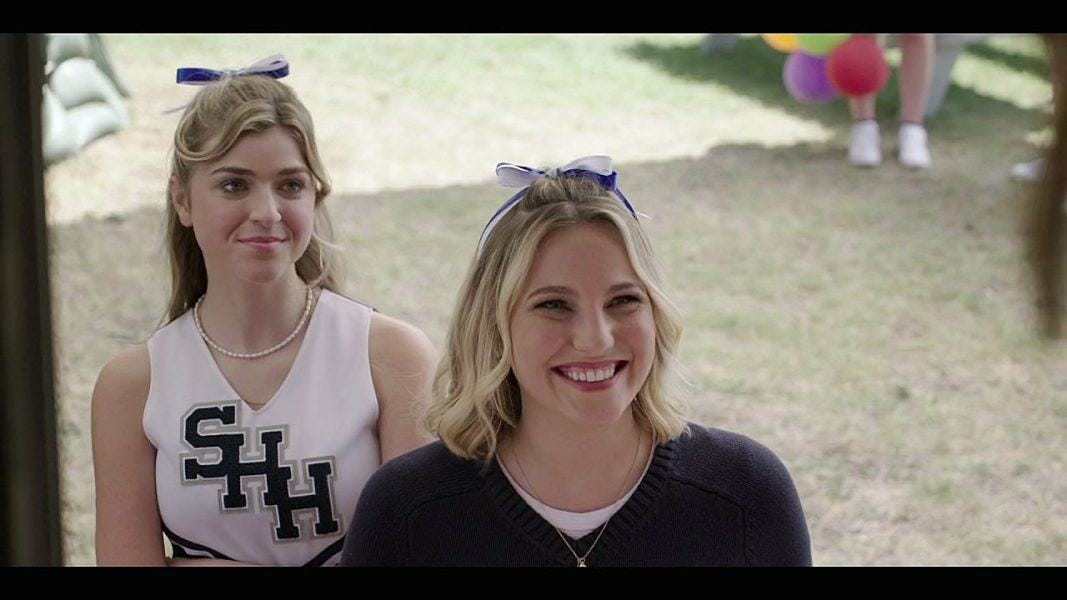 High School girl smiling sweetly at Stella and Geri at football game.