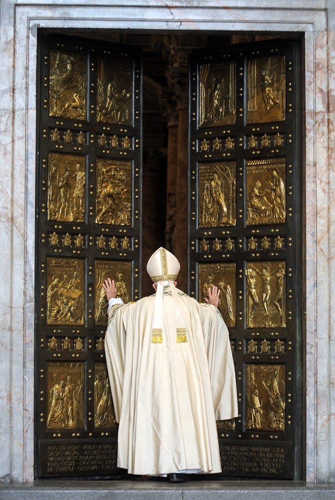 Pope Francis is seen opening the Holy Door of St. Peter's Basilica to welcome the jubilee of 2016.