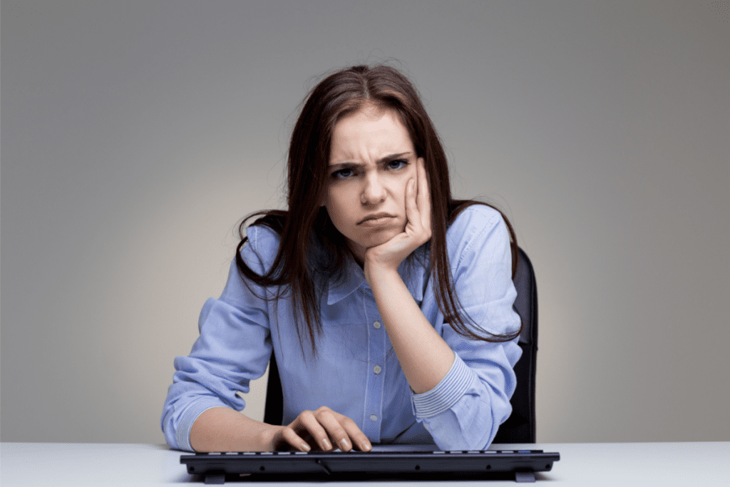 grumpy woman using keyboard