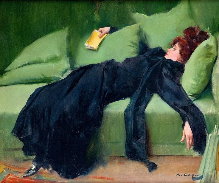 Young woman collapsed on a green sofa circa 1899