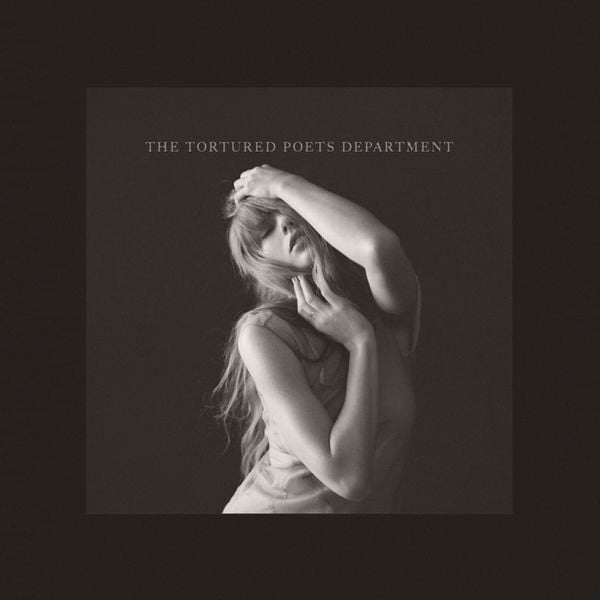 the cover of The Tortured Poets Department shows Taylor Swift in black and white