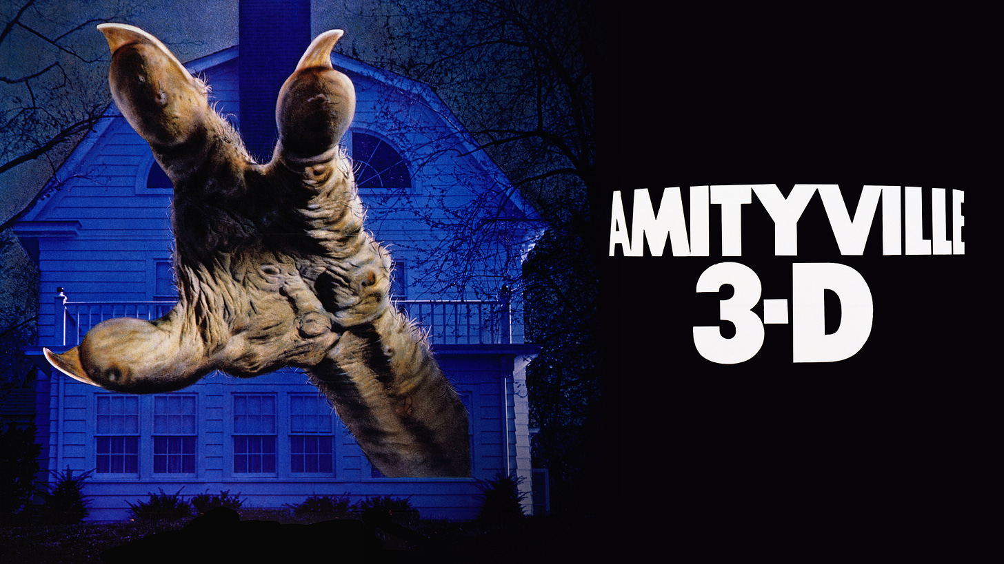 The cover image for Amityville 3-D, with a picture of a goblin hand emerging from the amitvyville house