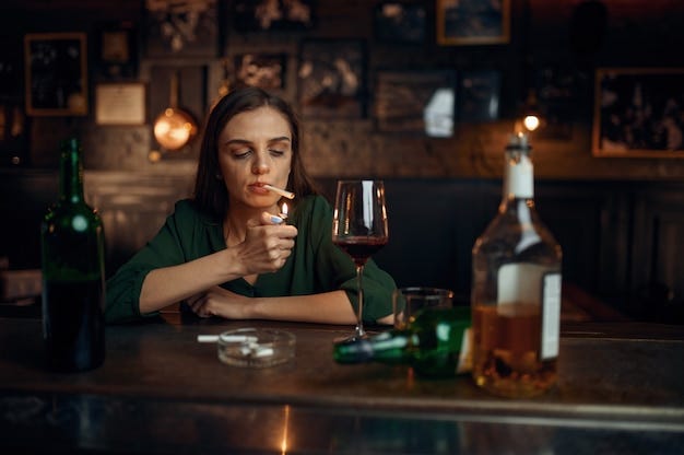 Premium Photo | Drunk woman smokes a cigarette at the counter in bar